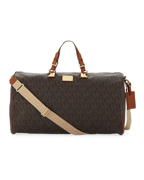 michael kors brown duffel bag|Michael Kors large suitcase.